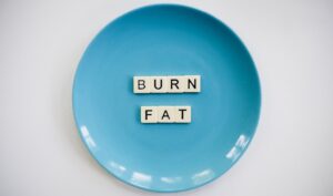 Blue plate that reads 'BURN FAT'