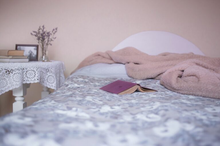 Bed with book and blanket