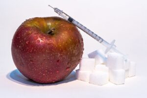 Apple and syringe 