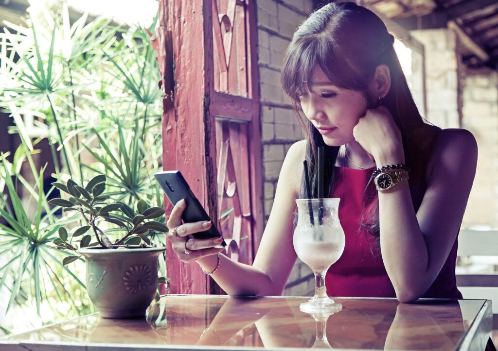 Women at table suffering from procrastination